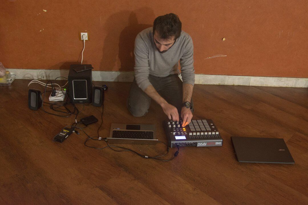 Live streaming encoder setup with laptops and audio mixer